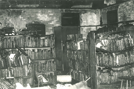 Charred and damaged library shelves